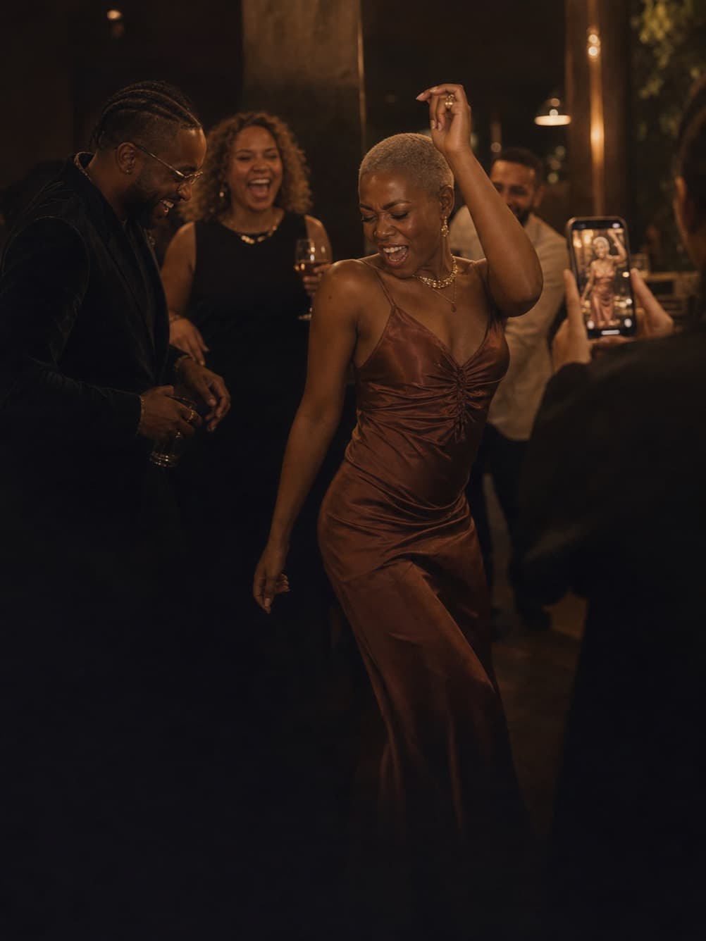 Friends capturing a lively late-night dance floor on their phones